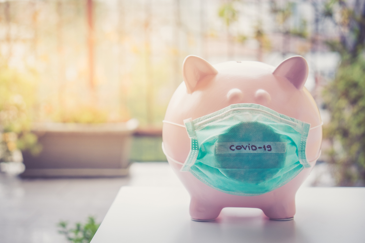 Piggy bank with Face Mask, Financial crisis and market crash due to coronavirus
