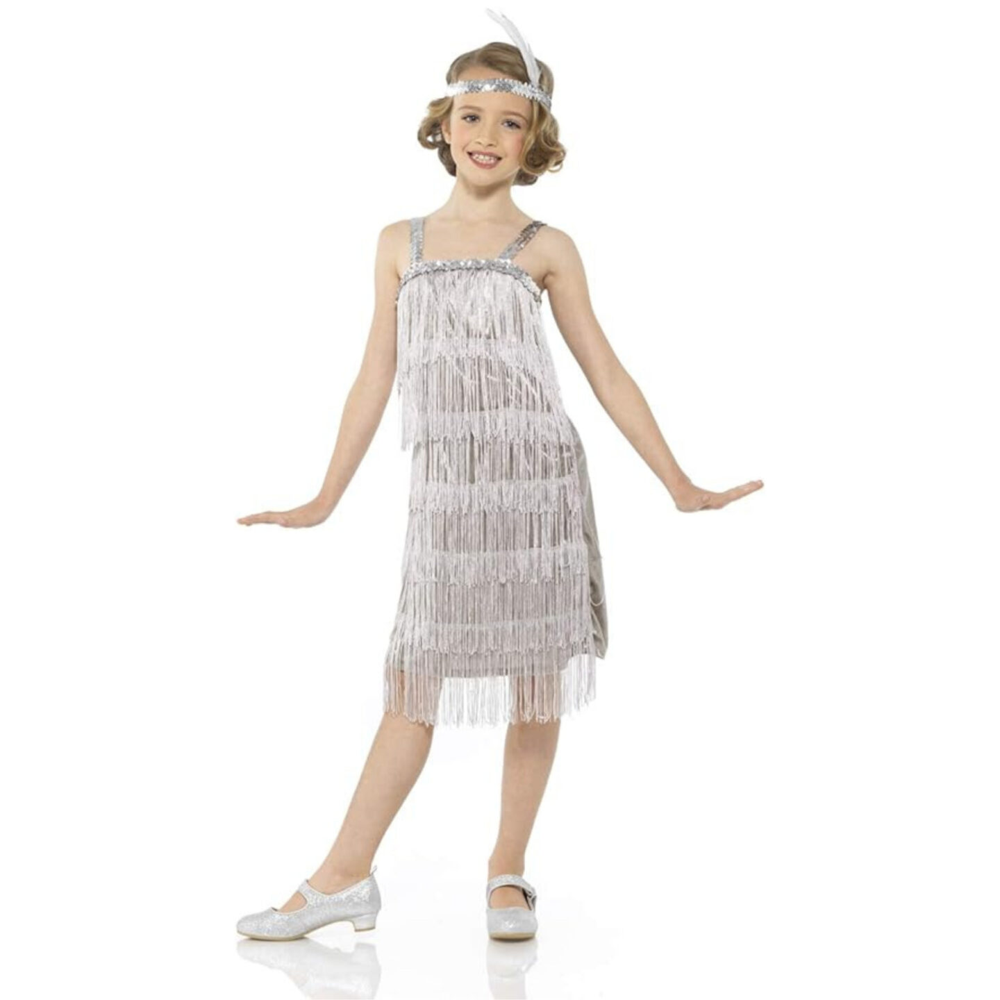 Young girl dressed in a flapper-inspired outfit, perfect for kids' Taylor Swift 'Eras Tour' costumes. She is wearing a silver fringe dress with sparkly details, paired with silver Mary Jane shoes and a matching headband with a feather. This outfit captures the glamorous, vintage style reminiscent of Taylor Swift's 'Fearless' era stage costumes.