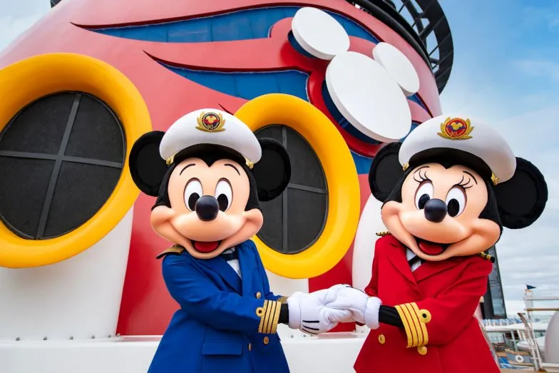 Mickey and Minnie Mouse in captain uniforms on the Disney Wonder cruise ship.